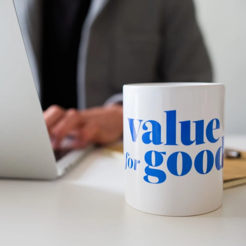 A ceramic mug featuring the phrase "Value for Good," symbolizing positivity and social responsibility.