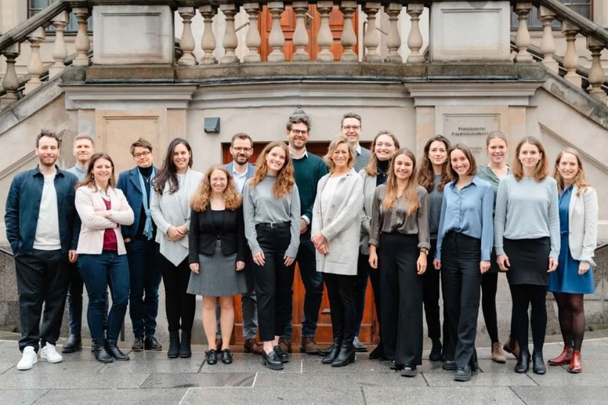A diverse team from the New York office of a law firm, united under the motto "Team Value for Good.